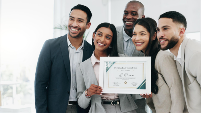 Professionals celebrating their successful completion of a professional certification program at Inspire Training Academy, showcasing career growth and industry-recognized learning.