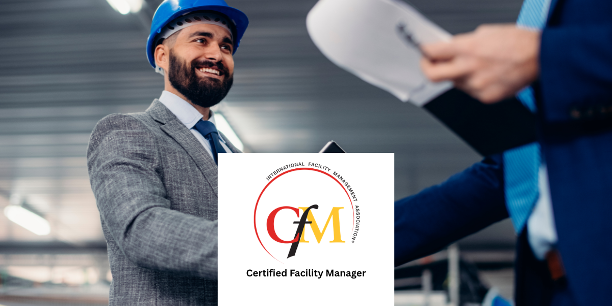 Professional facility manager wearing a blue safety helmet shaking hands during a workplace inspection, with documents in hand and the IFMA Certified Facility Manager (CFM) certification logo displayed in the foreground.