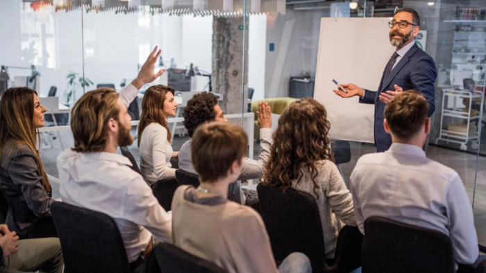 Employees participating in a professional training session to improve workplace skills