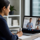 Working professional attending a live online training session with an instructor and participants, representing virtual learning and professional skill development.