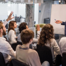 Employees participating in a professional training session to improve workplace skills