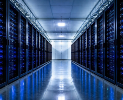 Modern data centre server room with rows of server racks and blue LED lights.
