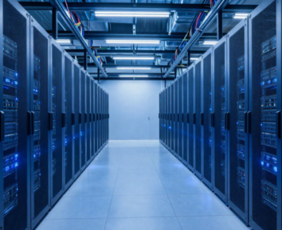 Modern data center server room with rows of network and server racks, blue LED lights, and enterprise IT infrastructure for data center operations and CDCP certification training.