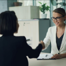 A professional image of a working professional calmly managing emotions, thinking positively, or interacting confidently with others. - write me a title for this based on this image