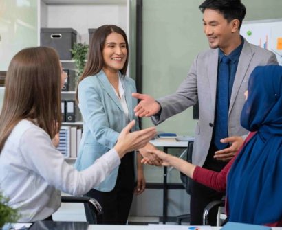 “Professionals building strong workplace relationships through interpersonal skills.”