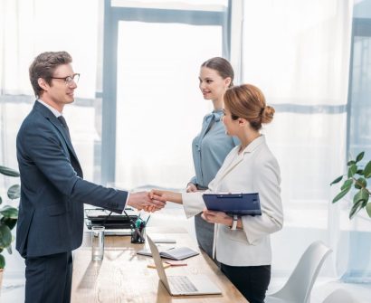 happy-employee-shaking-hands-with-recruiter-on-job-interview-e1703438473208.jpg
