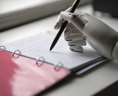 robotic-hand-writing-in-a-notebook-technology-conc-2026-01-07-01-21-58-utc-scaled-1.jpg